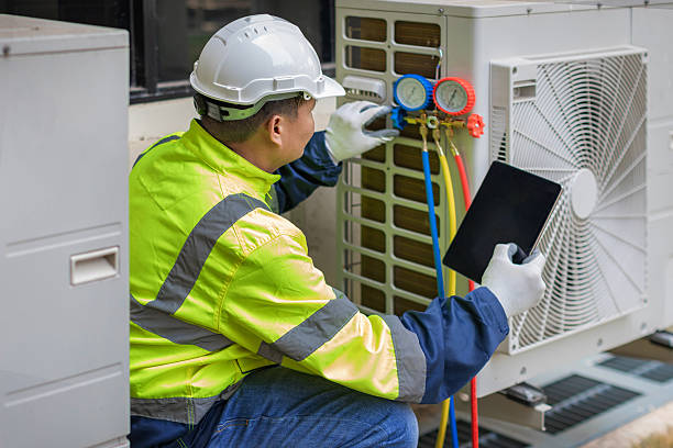 Professional Air Duct Cleaning technician working in East Concord, NY